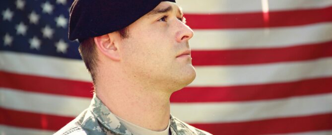 Veteran in front of American flag